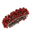 Resplendent in red. This stretch bracelet from Haskell is crafted from hematite-tone mixed metal, with red glass beads in bunches for a stylish touch. Approximate length: 7-1/2 inches.