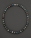 Darkly shimmering Tahitian pearls with 14K. white gold.