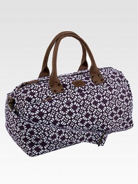 A graphic floral pattern is both sweet and sophisticated, printed on sturdy cotton in a roomy duffel.Top zip closureLeather double handlesDetachable, adjustable shoulder strapInside and outside zip pockets18¾L X 9½H X 9¼DCottonSpot cleanImported A graphic floral pattern is both sweet and sophisticated, printed on sturdy cotton in a roomy duffel.Top zip closureLeather double handlesDetachable, adjustable shoulder strapInside and outside zip pockets18¾L X 9½H X 9¼DCottonSpot cleanImported