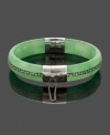 Effortless and chic, this simple slip-on style creates a look of polished elegance. A Greek-key pattern adds character to this solid jade bangle (10-1/2 mm-13 mm). Accents and clasp crafted in sterling silver. Approximate diameter: 2-1/4 inches.