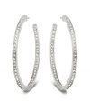 Stellar style fit for a celebrity. This elegant pair of silver tone mixed metal hoop earrings sparkles in clear Swarovski crystal pavé and reflects the light in a thousand facets. These unique earrings add a touch of sophistication to your look. Approximate diameter: 1-7/8 inches.