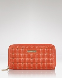 Studs detail this Rebecca Minkoff leather wallet, which zips open to reveal a well-organized interior with 8 credit card pockets and one zip pocket. Studs detail this Rebecca Minkoff leather wallet, which zips open to reveal a well-organized interior with 8 credit card pockets and one zip pocket.