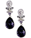 Polished, poised and stunningly purple. Givenchy's regal drop earrings combine pear-cut violet crystals with lavender-hued crystal accents. Setting and clip-on backing crafted in silver tone mixed metal. Approximate drop: 1-1/2 inches.