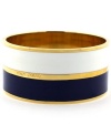 Sailor's delight. A nautical theme takes shape in the form of navy and white enamel stripes on Vince Camuto's trendy bangle bracelet. Crafted in gold tone mixed metal. Approximate diameter: 2-1/2 inches.