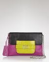 A coolly versatile day take on the power clutch. This blocked leather DIANE von FURSTENBERG piece is designed with an optional shoulder strap which effortlessly transitions from day-to-out-all-night.