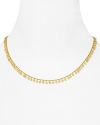 Turn up the volume on your neckline with this delicate gold necklace from Melinda Maria, trimmed in delicate gold pod beads.