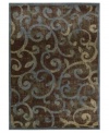 Retreat to a comfortable new space. This distinctive rug offers a slightly worn look, graced with a beautiful vinery pattern in varying shades of blue, beige and black. Created from a durable blend of polypropylene and acrylic, the Expressions rug is designed to retain both its color and its luxuriously dense weave for years to come.