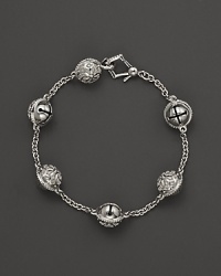 Inspired by Zen philosophy, this intricately detailed sterling silver bracelet from Paul Morelli softly jingles with meditation bells. Inspired by Zen philosophy, this intricately detailed sterling silver bracelet from Paul Morelli softly jingles with meditation bells.