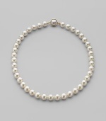 A classic strand of white organic man-made pearls is essential elegance. 10mm white round pearls Length, about 18 18k gold vermeil and mabé pearl push-lock clasp Made in Spain