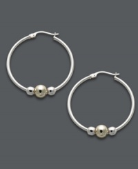 Trendy two tone. Giani Bernini's versatile hoop earrings feature a sterling silver setting with beaded accents in sterling silver and 24k gold over sterling silver. Approximate diameter: 1-1/5 inches. Trendy two tone. Giani Bernini's versatile hoop earrings feature a sterling silver setting with beaded accents in sterling silver and 24k gold over sterling silver. Approximate diameter: 1-1/5 inches.