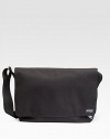 A rugged, everyday look crafted in lasting denier canvas with a convenient laptop compartment. Grip tape closure Exterior zip pocket Interior zip and organizing pockets Laptop compartment Adjustable shoulder strap 18W X 11½H X 5½D Imported 