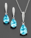 Make an impact with dramatic drops of piercing pear-shaped blue topaz (6-3/8 ct. t.w.). Necklace and earrings set in sterling silver. Approximate length: 18 inches.