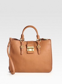 A classic design in supple leather with a detachable shoulder strap.Double top handles, 5 dropDetachable shoulder strap, 20 dropPush-lock strap closureThree inner compartmentsOne inside zip pocketOne inside open pocketSuede lining13¾W X 10H X 5DMade in Italy A classic design in supple leather with a detachable shoulder strap.Double top handles, 5 dropDetachable shoulder strap, 20 dropPush-lock strap closureThree inner compartmentsOne inside zip pocketOne inside open pocketSuede lining13¾W X 10H X 5DMade in Italy