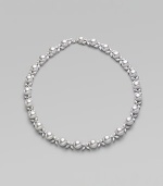 Lovely organic pearls and sparkling cubic zirconia accents blend in one gracious style. 10mm white round man-made pearls Cubic zirconia Rhodium-plated sterling silver Length, about 17 Push-lock clasp with mabé pearl accent Imported