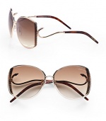 This sleek design boasts a ridged metal frame with hook detailed temples for a truely unique look. Available in shiny rose gold/havana with brown gradient lens. Hook detailed temples100% UV protectionMade in Italy 