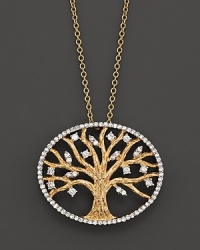 Diamonds, set in 14K yellow gold, bloom in and around a tree of life. Diamonds, set in 14K yellow gold, bloom in and around a tree of life.