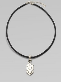 A carved sterling silver pendant drops from a finely braided leather necklace. From the Classic Chain Collection Sterling silver Leather Necklace, about 18 long Imported A carved sterling silver pendant drops from a finely braided leather necklace. From the Classic Chain Collection Sterling silver Leather Necklace, about 18 long Imported