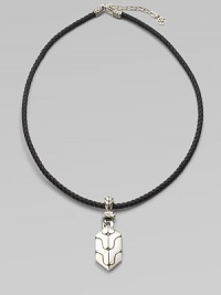 A carved sterling silver pendant drops from a finely braided leather necklace. From the Classic Chain Collection Sterling silver Leather Necklace, about 18 long Imported