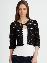 Soft cotton, crocheted in a lacy, open-weave design.CottonFront hook-and-eye closureThree-quarter sleevesAbout 15 from shoulder to hemImportedDry clean Soft cotton, crocheted in a lacy, open-weave design.CottonFront hook-and-eye closureThree-quarter sleevesAbout 15 from shoulder to hemImportedDry clean