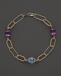 Faceted oval amethyst and blue topaz add rich sparkle to links of 14K yellow gold. By Nancy B. Faceted oval amethyst and blue topaz add rich sparkle to links of 14K yellow gold. By Nancy B.