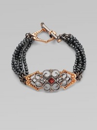 From the Les Dents de la Mer Collection. The distinctive jagged shape of a shark's jaw is artfully woven into the filigree design of this pretty and witty five-strand bracelet of faceted hematite beads with a garnet accent.Red garnetHematiteRose goldplated sterling silver and black rhodium-plated sterling silverLength, about 7¾Shark jaw toggle claspImported From the Les Dents de la Mer Collection. The distinctive jagged shape of a shark's jaw is artfully woven into the filigree design of this pretty and witty five-strand bracelet of faceted hematite beads with a garnet accent.Red garnetHematiteRose goldplated sterling silver and black rhodium-plated sterling silverLength, about 7¾Shark jaw toggle claspImported