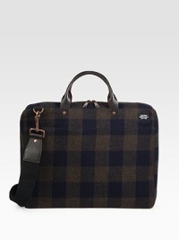 A lightly padded laptop case designed in rugged plaid-check wool with leather handles. Zip closure16L X 12H X 3DImported