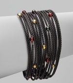 From the Black and Gold Chain Collection. Beautiful garnet, hematite and 18k gold beads accent this blackened sterling silver box chain design. Garnet, hematite and 18k gold beadsBlackened sterling silverLength, about 7½Push clasp closureImported 