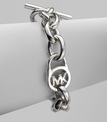 A sleek silvertone design with an iconic logo embellished lock on a chain link. Silvertone metalLength, about 8Toggle closureImported 