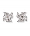 Dainty X-shaped clip on earrings flaunt clear Swarovski crystals in a pavé setting. These silver tone mixed metal earrings bridge the gap between classic and trendy. Approximate diameter: 5/8 inch.