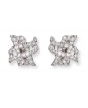 Dainty X-shaped clip on earrings flaunt clear Swarovski crystals in a pavé setting. These silver tone mixed metal earrings bridge the gap between classic and trendy. Approximate diameter: 5/8 inch.