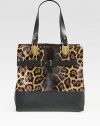 A strong exotic print and polished hardware define this chic carryall, mixing ultra-smooth leather with soft pony hair. Double leather top handles, 8¾ dropOne inner zip pouchReverses to brown leather12W X 12H X 6DMade in Italy