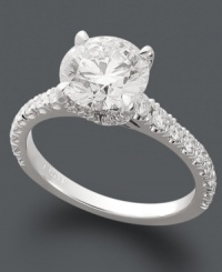 Dazzle her with a stunning diamond engagement ring. X3's breathtaking style features a round-cut diamond (1-1/2 ct. t.w.) surrounded by sparkling diamonds at the shoulders. Set in 18k white gold. Dazzle her with a stunning diamond engagement ring. X3's breathtaking style features a round-cut diamond (1-1/2 ct. t.w.) surrounded by sparkling diamonds at the shoulders. Set in 18k white gold.