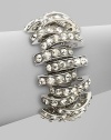 Bold, open arcs set with shimmering faceted Swarovski crystals.CrystalSilverplatedWidth, about 1Length, about 6½Hidden magnetic claspMade in Italy