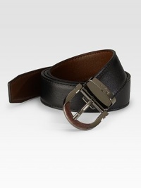 A modern classic crafted in reversible calfskin leather with an adjustable gancino buckle. Reverses from black to brown Leather Ruthenium buckle About 1 wide Made in Italy 