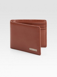 Modern classic bifold design features front logo plaque detail, three credit crad slots and one ID slot set in luxuriously soft leather.One billfoldThree card slotsOne clear identification windowLeather4W x 4H x 1DImported