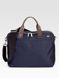 A smart, stylish case for a laptop and much more, in sophsiticated embossed nylon with fine leather trim.Two top zip compartments TSA-approved padded laptop pocket Double leather handles Detachable, adjustable shoulder strap Die-cast hardware Outside open pocket Interior zip pocket Cotton lining 16W X 12½H X 3¾D Imported A smart, stylish case for a laptop and much more, in sophsiticated embossed nylon with fine leather trim.Two top zip compartments TSA-approved padded laptop pocket Double leather handles Detachable, adjustable shoulder strap Die-cast hardware Outside open pocket Interior zip pocket Cotton lining 16W X 12½H X 3¾D Imported