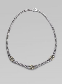 A chunky strand of large and little sterling silver links includes cabled texture links framing ones of smooth 18k gold. Sterling silver and 18k yellow gold Length about 16½ Lobster clasp Made in Italy