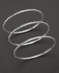 From the Bedeg Collection, three slender sterling silver bangles, perfect for stacking. From the Bedeg Collection, three slender sterling silver bangles, perfect for stacking.