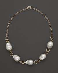 Boldly gleaming baroque freshwater pearls add rich luster to 14K yellow gold. By Nancy B. Boldly gleaming baroque freshwater pearls add rich luster to 14K yellow gold. By Nancy B.