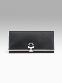 Saffiano texture leather wallet with silvertone signature Gancini clip closure. Opens to ID window, seven credit card slots, four bill slots and zip change compartment. Lined. 4Hx7½L. Made in Italy. Saffiano texture leather wallet with silvertone signature Gancini clip closure. Opens to ID window, seven credit card slots, four bill slots and zip change compartment. Lined. 4Hx7½L. Made in Italy.