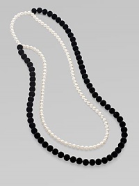 From the Night Blue Collection. This high contrast piece features strands of flocked velvet beads and pearlized glass beads. Length, about 45½ Slip-on style Imported 