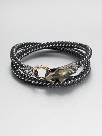 From the Naga Collection. A bold, braided strand of black nylon cord wraps the wrist twice, then clasps with a woven bronze ring and a Naga dragon hook of sterling silver.NylonSterling silver and bronzeStrap width, about .25Diameter, about 2.5Hook-and-ring closureMade in Bali From the Naga Collection. A bold, braided strand of black nylon cord wraps the wrist twice, then clasps with a woven bronze ring and a Naga dragon hook of sterling silver.NylonSterling silver and bronzeStrap width, about .25Diameter, about 2.5Hook-and-ring closureMade in Bali