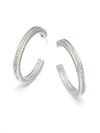 THE LOOKHoop silhouetteInset cubic zirconia accentsSterling silver settingPost backTHE MEASUREMENTLength, about 1.5ORIGINImported THE LOOKHoop silhouetteInset cubic zirconia accentsSterling silver settingPost backTHE MEASUREMENTLength, about 1.5ORIGINImported