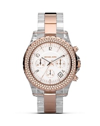 The chronograph is the new face of time. Here, from MICHAEL Michael Kors the rose goldplated watch is accented with crystal embellished bezel. With three-eye design and sweep second hand. Finished with a two-tone bracelet strap. The chronograph is the new face of time. Here, from MICHAEL Michael Kors the rose goldplated watch is accented with crystal embellished bezel. With three-eye design and sweep second hand. Finished with a two-tone bracelet strap.