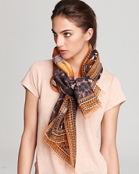 A sophisticated center pattern, subdued leopard print and bright orange background make up this stunning scarf from Emilio Pucci. A sophisticated center pattern, subdued leopard print and bright orange background make up this stunning scarf from Emilio Pucci.