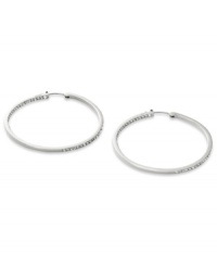 Go full-blitz with these glitzy hoop earrings from Fossil. The classic design is amped up with clear pave crystal accents. Crafted in polished stainless steel. Approximate diameter: 2 inches. Go full-blitz with these glitzy hoop earrings from Fossil. The classic design is amped up with clear pave crystal accents. Crafted in polished stainless steel. Approximate diameter: 2 inches.