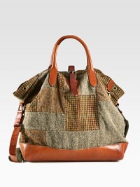 Evoking the aesthetic of vintage fishing bags, a timeless silhouette receives modern polish from a patchwork tweed construction with leather accents.Roller-buckle closureDouble top handlesAdjustable shoulder strapInterior zip pocketAntiqued brass grommet detailingReinforced leather bottomCotton twill liningTweed17W x 16H x 6DImported Evoking the aesthetic of vintage fishing bags, a timeless silhouette receives modern polish from a patchwork tweed construction with leather accents.Roller-buckle closureDouble top handlesAdjustable shoulder strapInterior zip pocketAntiqued brass grommet detailingReinforced leather bottomCotton twill liningTweed17W x 16H x 6DImported