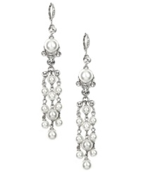 Gown, bouquet, accessories! These flowing chandelier-shaped bridal earrings by Givenchy are the perfect something new for your big day. Crafted in silver-plated mixed metal, earrings feature glass pearls and white glass accents. Approximate drop: 3-7/8 inches. Gown, bouquet, accessories! These flowing chandelier-shaped bridal earrings by Givenchy are the perfect something new for your big day. Crafted in silver-plated mixed metal, earrings feature glass pearls and white glass accents. Approximate drop: 3-7/8 inches.