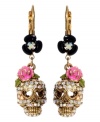 Cuteness to die for, Betsey Johnson does it again. Crystal skulls with heart-shaped eyes and pink flower accents hang from black enamel flowers. Earrings crafted from antique gold-plated mixed metal. Approximate drop: 1-1/2 inches.