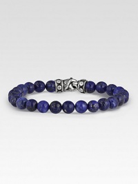 Rugged, lightly-textured lapis beads stand in stark contrast to the bracelet's hand-forged, sterling silver clasp. Beads, 8mm Length, about 8½ Lobster clasp Made in USA Rugged, lightly-textured lapis beads stand in stark contrast to the bracelet's hand-forged, sterling silver clasp. Beads, 8mm Length, about 8½ Lobster clasp Made in USA